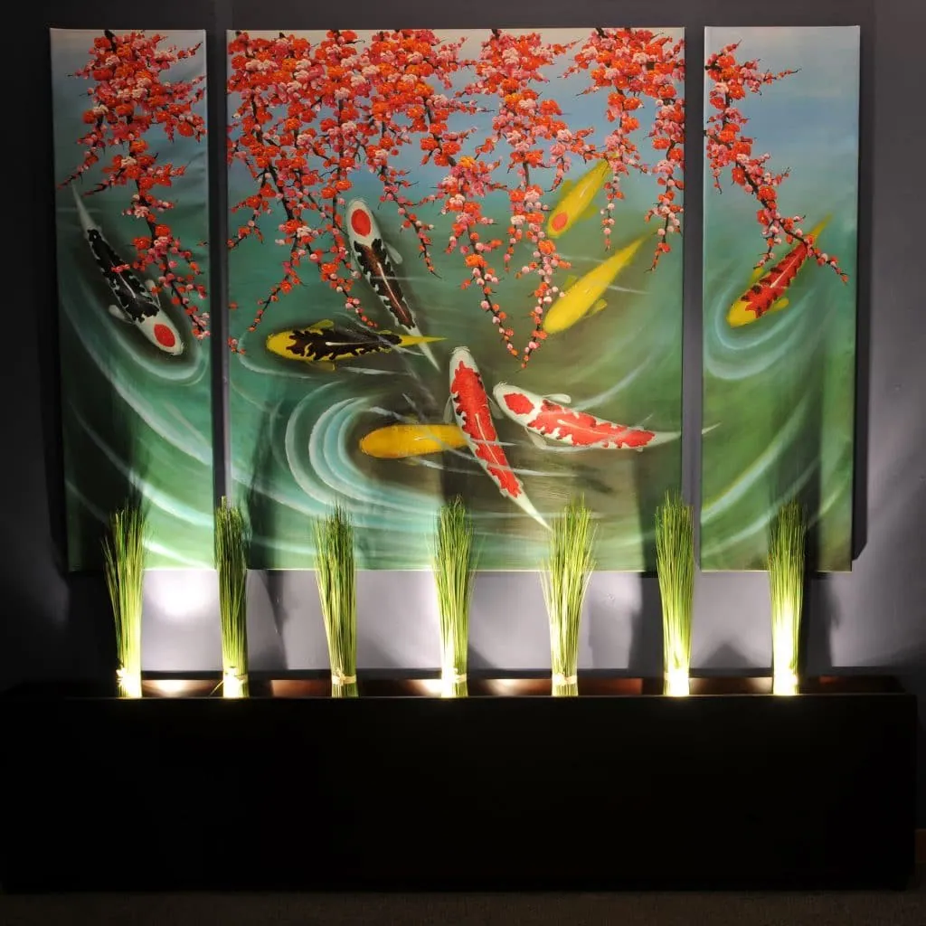 Painted triptych of koi carp under blossoming branches, above uplit tall grasses