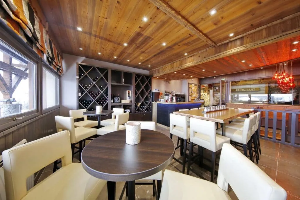 Overview of the wine bar with bespoke wine rack, counter and wooden ceiling