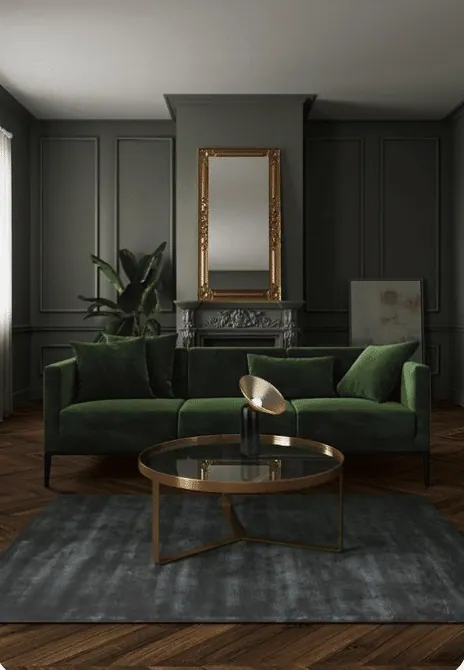 Living room with charcoal panelled walls, green velvet sofa, gilded mirror and dark wood floor